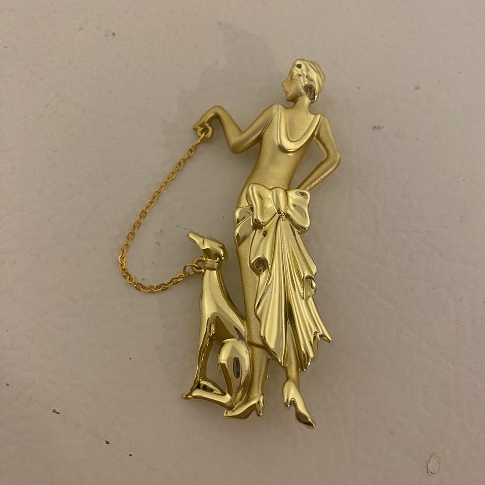 Vintage Elegant Gold Brooch with Woman and Dog Design